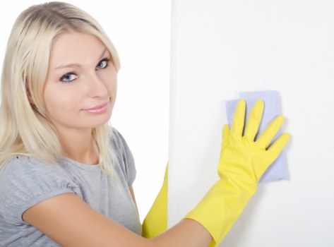 Detailed house cleaning in Highbury focusing on kitchen surfaces and appliances